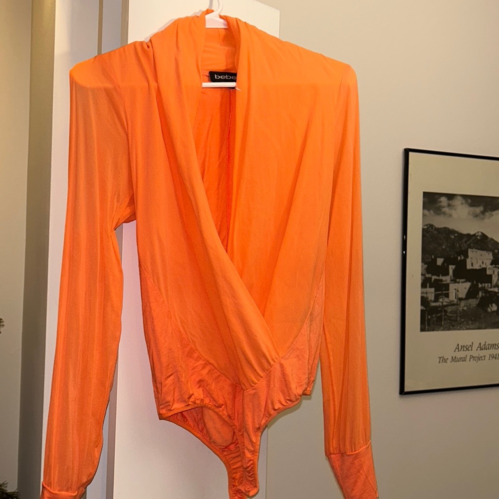 Flattering v neck bodysuit. Fun color perfect for summer!